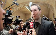 Eric Roux, head of the Paris Celebrity Centre of Scientology, answers questions at the court house.  Photo: AFP/GETTY  