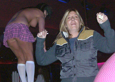 Photo of Yael Lustgarten dancing with a stripper, December 2007