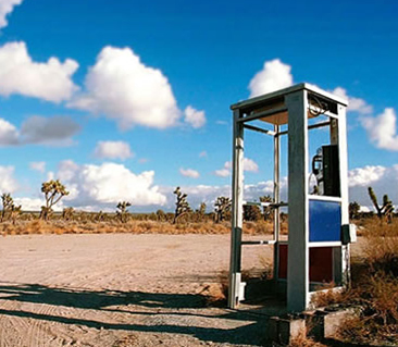 Photo of a pay phone in the desert